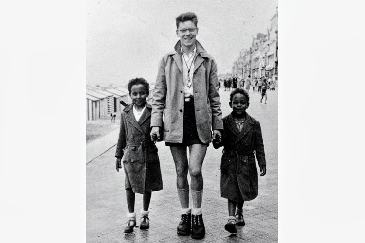 A photo of two boys and a man